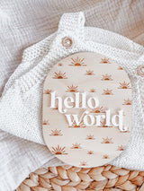 Oval “hello world” baby announcement plaque - sun rays