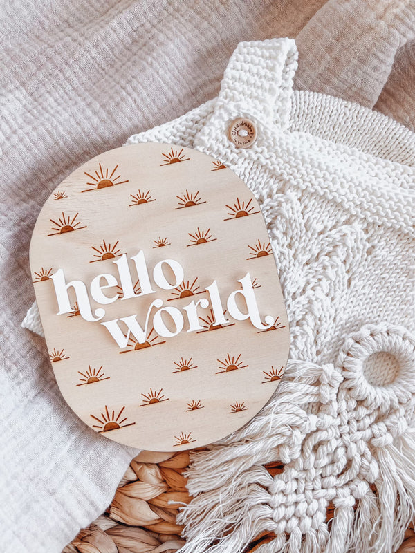 Oval “hello world” baby announcement plaque - sun rays