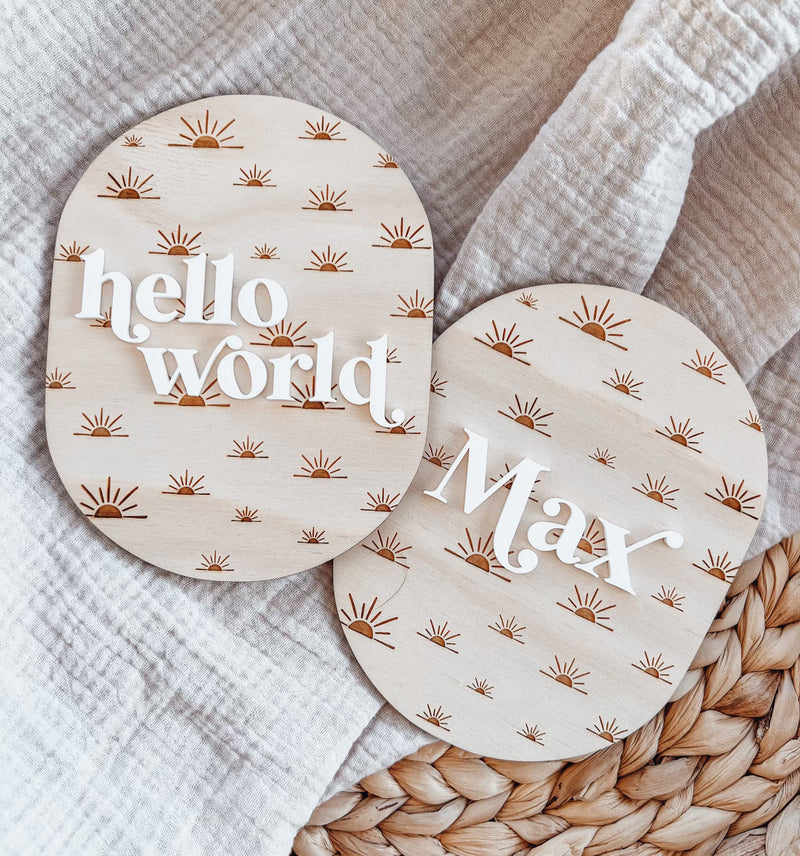 Oval “hello world” baby announcement plaque - sun rays
