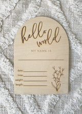 "Hello world" arch announcement plaque with floral bunch