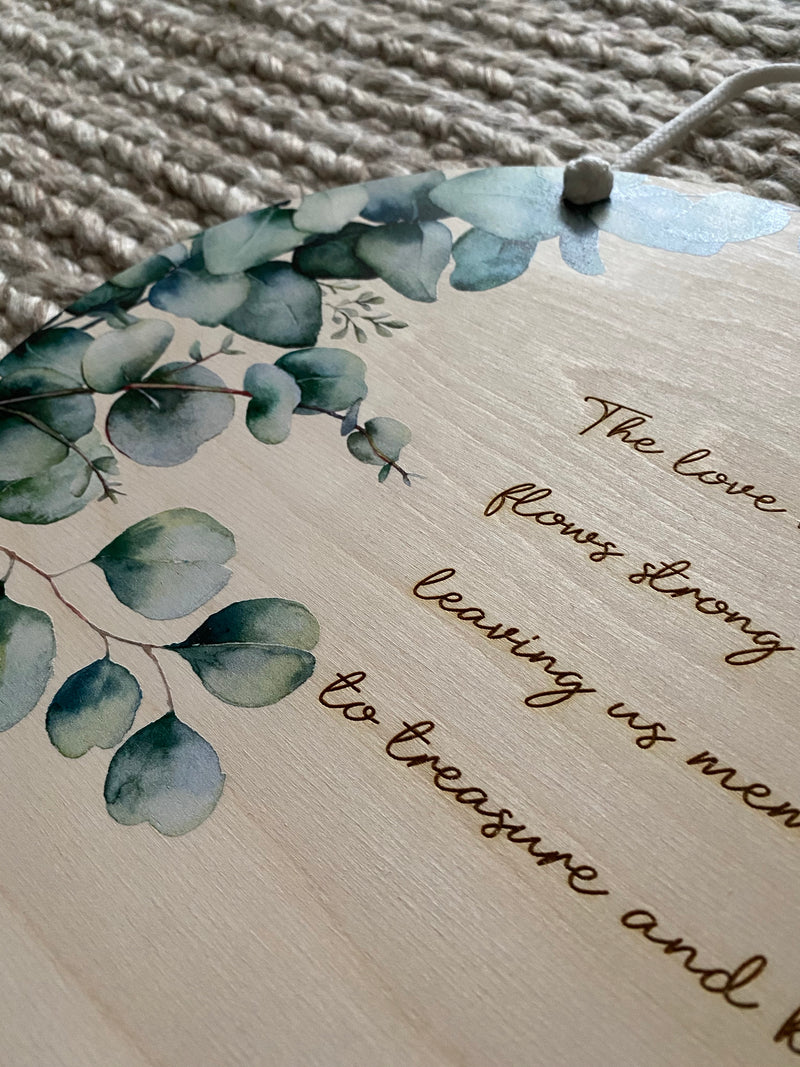 Eucalyptus printed plaque with “family” quote