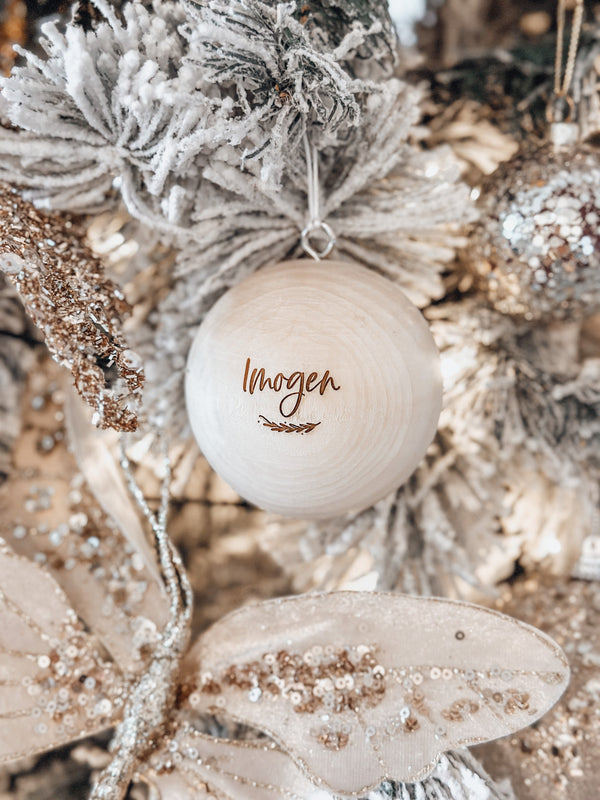 Solid wooden Christmas ball bauble with engraving - name with vine