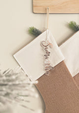 Natural burlap Christmas stocking with frosted name tag