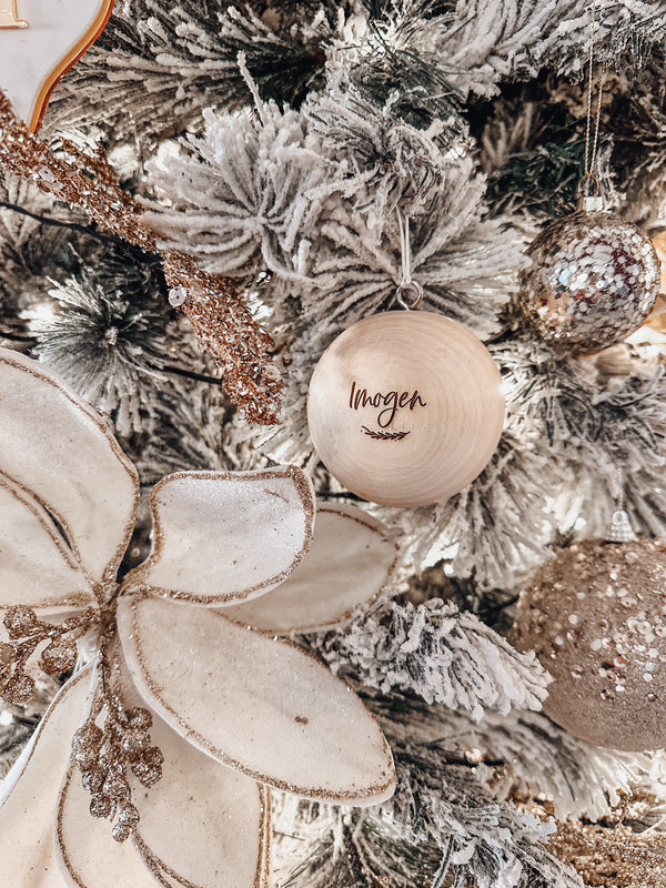 Solid wooden Christmas ball bauble with engraving - name with vine