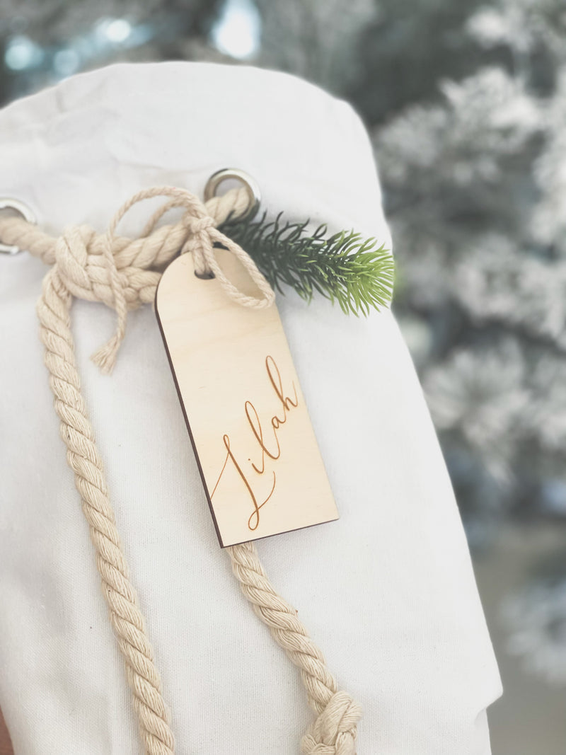 White cotton Santa sack with timber arch-shaped tag