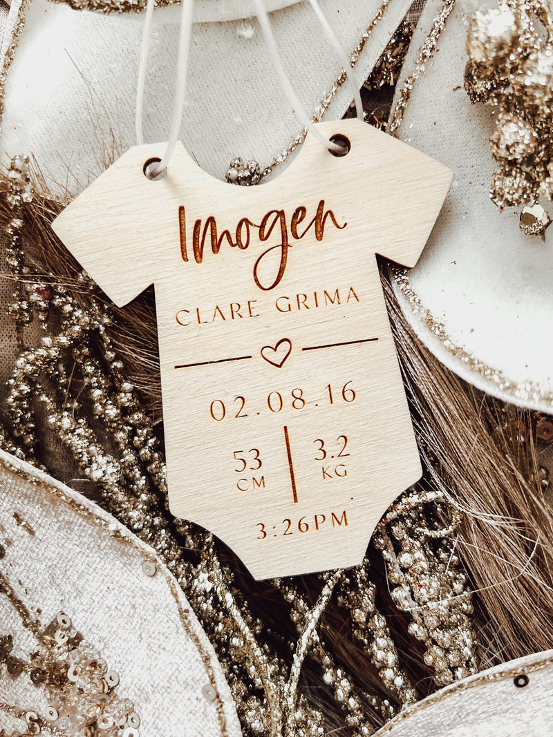 Baby's Christmas romper ornament with birth details