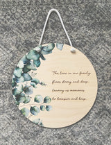 Eucalyptus printed plaque with “family” quote