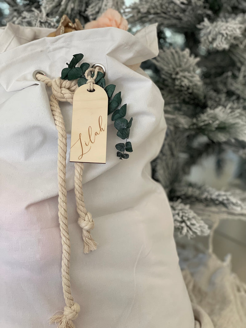 White cotton Santa sack with timber arch-shaped tag