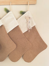 Natural burlap Christmas stocking with frosted name tag
