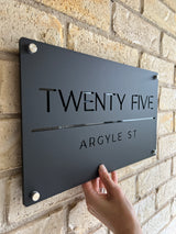Matte black house address sign with stand-off mounts